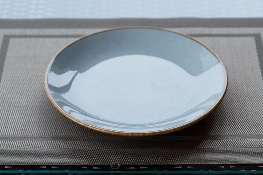 Empty plate of blue glaze ceramic melamine for dinner.