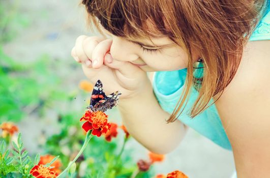 Child with a butterfly. Selective focus. nature and child.