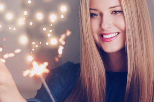 Holiday magic, Christmas and New Year celebration, happy woman with sparklers, portrait