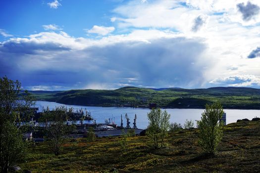 Murmansk, Russia-June 5, 2015: Industrial landscape on the shore of the Kola Bay.