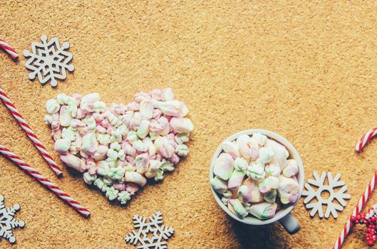 Hot chocolate and marshmallow on christmas background. Selective focus.