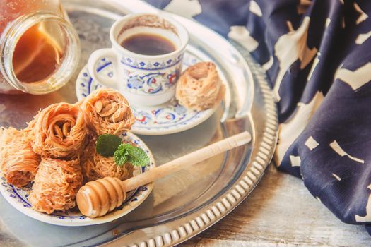 Eastern sweetness, baklava with peanuts and honey. Isolate. Selective focus. Food.