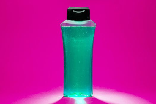 white bottle with cream, shampoo for hair, shower gel, colored background, beautiful studio light, beauty and youth of the human body