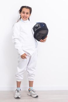 little girl in a fencing suit.