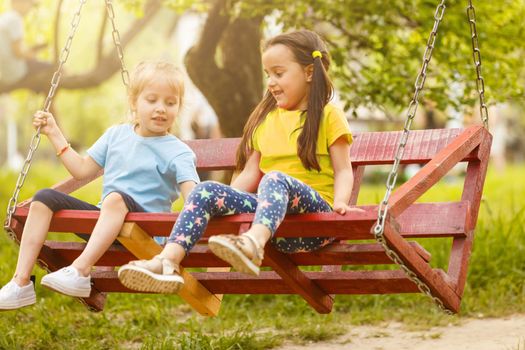 Two Little Girls Having Fun in the Park