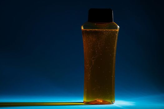 bottle with cream, shampoo for hair, shower gel, colored background, beautiful studio light, beauty and youth of the human body
