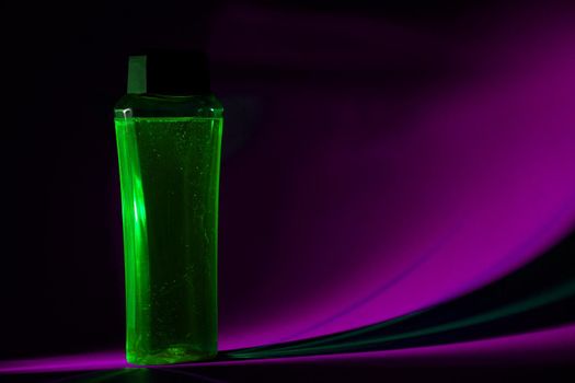 bottle with cream, shampoo for hair, shower gel, colored background, beautiful studio light, beauty and youth of the human body
