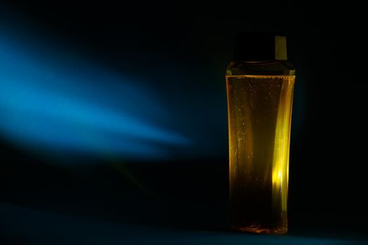 bottle with cream, shampoo for hair, shower gel, colored background, beautiful studio light, beauty and youth of the human body