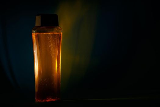 bottle with cream, shampoo for hair, shower gel, colored background, beautiful studio light, beauty and youth of the human body