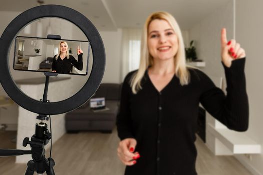 Female Blogger Creating Art Musical Vlog Content. Caucasian Woman Sitting at Living Room Playing Acoustic Guitar. Dreamy Girl Filming Practice Tutorial. Smiling Girl Perform Romance