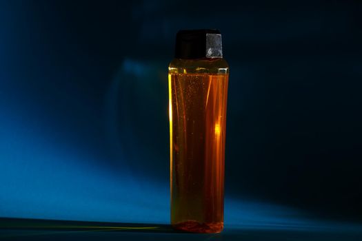 bottle with cream, shampoo for hair, shower gel, colored background, beautiful studio light, beauty and youth of the human body