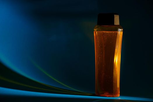 bottle with cream, shampoo for hair, shower gel, colored background, beautiful studio light, beauty and youth of the human body