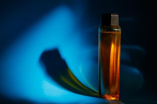 bottle with cream, shampoo for hair, shower gel, colored background, beautiful studio light, beauty and youth of the human body