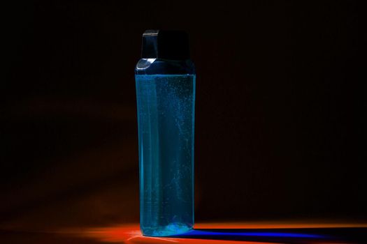 bottle with cream, shampoo for hair, shower gel, colored background, beautiful studio light, beauty and youth of the human body
