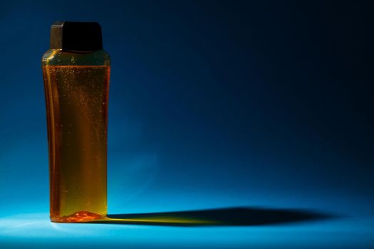 bottle with cream, shampoo for hair, shower gel, colored background, beautiful studio light, beauty and youth of the human body