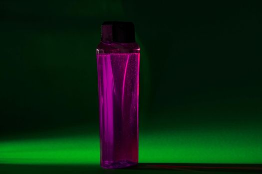 bottle with cream, shampoo for hair, shower gel, colored background, beautiful studio light, beauty and youth of the human body