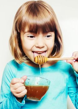 The child eats honey. Selective focus. nature food