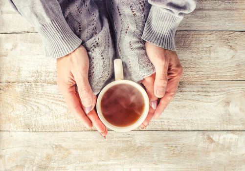 Cup drink for Breakfast in the hands of lovers. Selective focus. Nature.