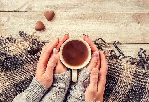 Cup drink for Breakfast in the hands of lovers. Selective focus. Nature.