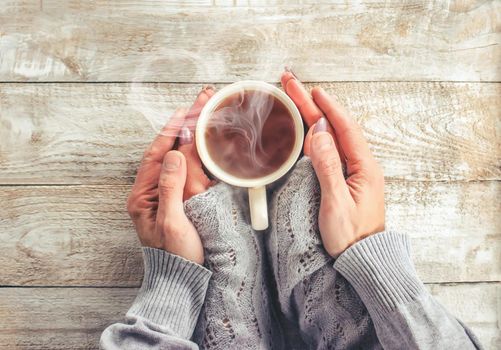 Cup drink for Breakfast in the hands of lovers. Selective focus. Nature.