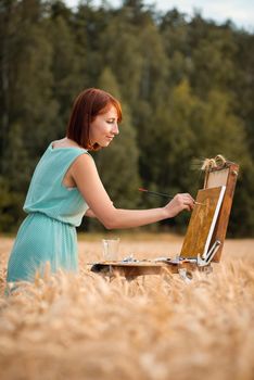 Calm and joyful artist finishing drawing, vertical photo