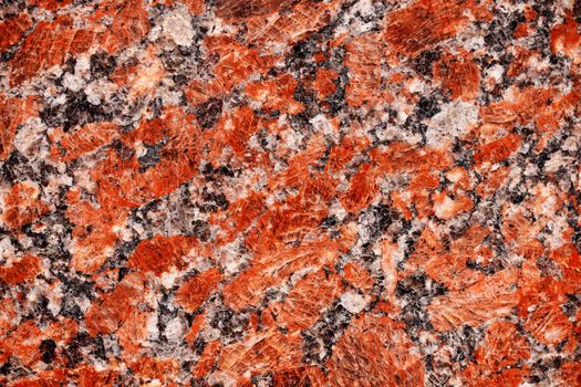 Red granite tile texture close up. Nature granite texture background. Polished decorative stone for photo design. Macro red grey granite decorative tile background may be used as a design pattern.