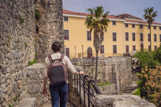 Man tourist in Herceg Novi old town. Historical and touristic center of Herceg Novi. Montenegro.