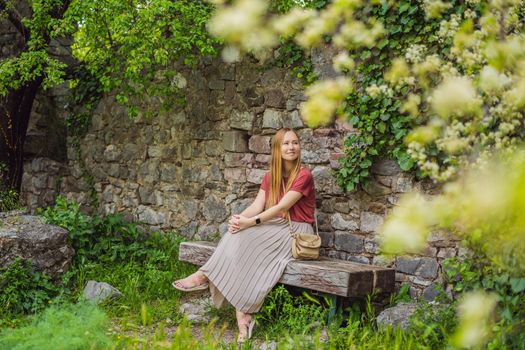 Woman tourist walks through the old town of Bar in Montenegro. Happy tourist walks in the mountains. Suburbs of the city of Bar, Montenegro, Balkans. Beautiful nature and landscape.