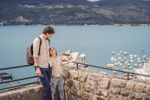 Father and son tourists in Herceg Novi old town. Historical and touristic center of Herceg Novi. Montenegro.