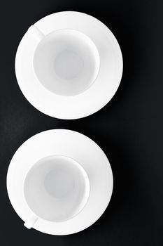 Kitchen, table decor and drinks menu concept - White tableware crockery set, empty cup on black flatlay background