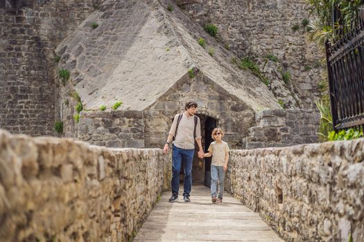 Father and son tourists in Herceg Novi old town. Historical and touristic center of Herceg Novi. Montenegro.
