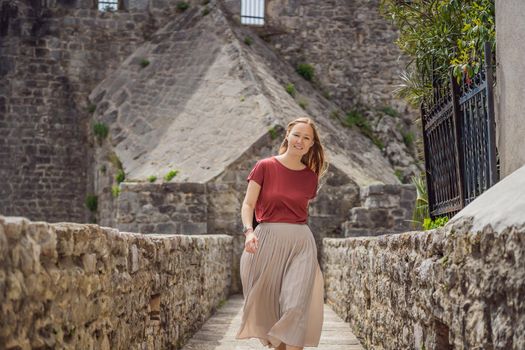 Woman tourist in Herceg Novi old town. Historical and touristic center of Herceg Novi. Montenegro.