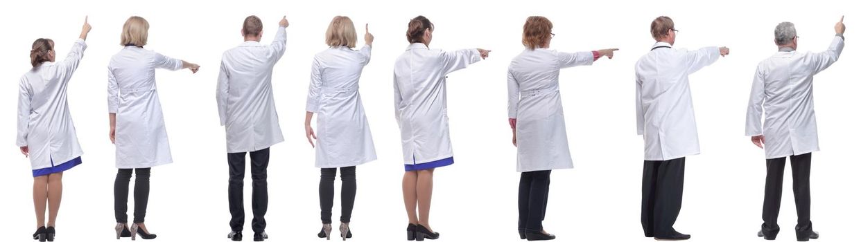 group of doctors standing with their backs isolated on white background