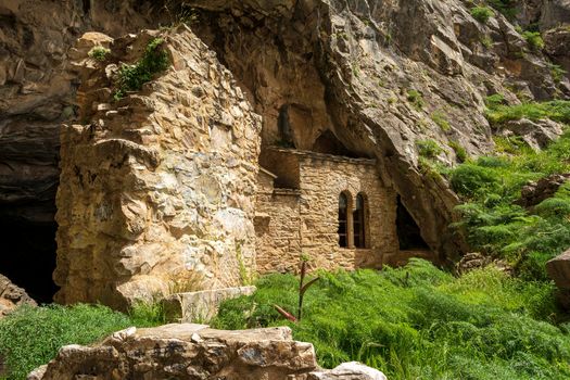Orthodox monastery enclosed by Davelis cave in Penteli, a mountain to the north of Athens, Greece.