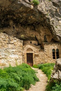 Orthodox monastery enclosed by Davelis cave in Penteli, a mountain to the north of Athens, Greece.