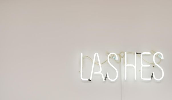 Shining Lashes white Neon Label. advertising for a beauty salon