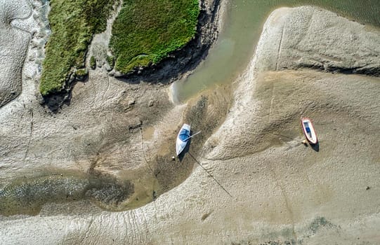 Low tide moored yacht aerial view