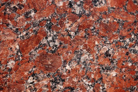 Nature granite texture background. Red granite tile texture close up. Polished decorative stone for photo design. Macro red grey granite decorative tile background may be used as a design pattern.