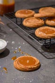 Caramel cookies flowing out of the oven, in the kitchen after baking.