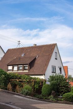 Traditional small house with beautiful outdoor decor facade in Germany. German old brick building house ancient European city German architect.