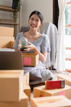 Asian small business owner working at home office. Business retail market and online sell marketing delivery, SME e-commerce concept.