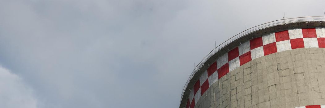 Coal-fired power plant tower blowing white smoke into sky Air pollution from an industrial chimney