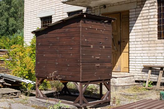 Wooden hive in the yard of the house close up