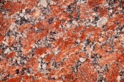 Nature granite texture background. Red granite tile texture close up. Polished decorative stone for photo design. Macro red grey granite decorative tile background may be used as a design pattern.