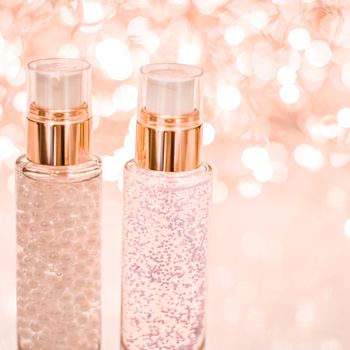 Cosmetic branding, blank label and glamour present concept - Holiday make-up base gel, serum emulsion, lotion bottle and rose gold glitter, luxury skin and body care cosmetics for beauty brand ads