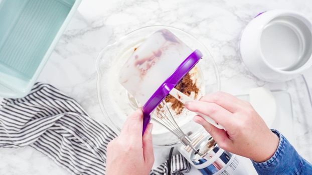 Flat lay. Step by step. Preparing homemade chocolate ice cream in a hand kitchen mixer.