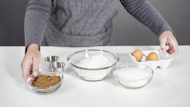 Step by step. Ingredients in a glass mixing bowls to bake chocolate cookies.