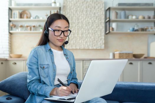 Young asian woman working from home remotely online, businesswoman using headset and laptop for video call, woman working in tech support and customer service.