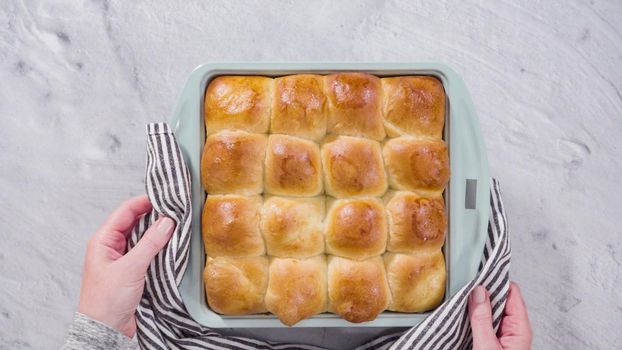Flat lay. Preparing dinner rolls from the frozen dough in baking pan.