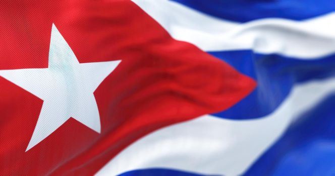 Close-up view of the Cuba national flag waving in the wind. The Republic of Cuba is an island state in Central America. Fabric textured background. Selective focus